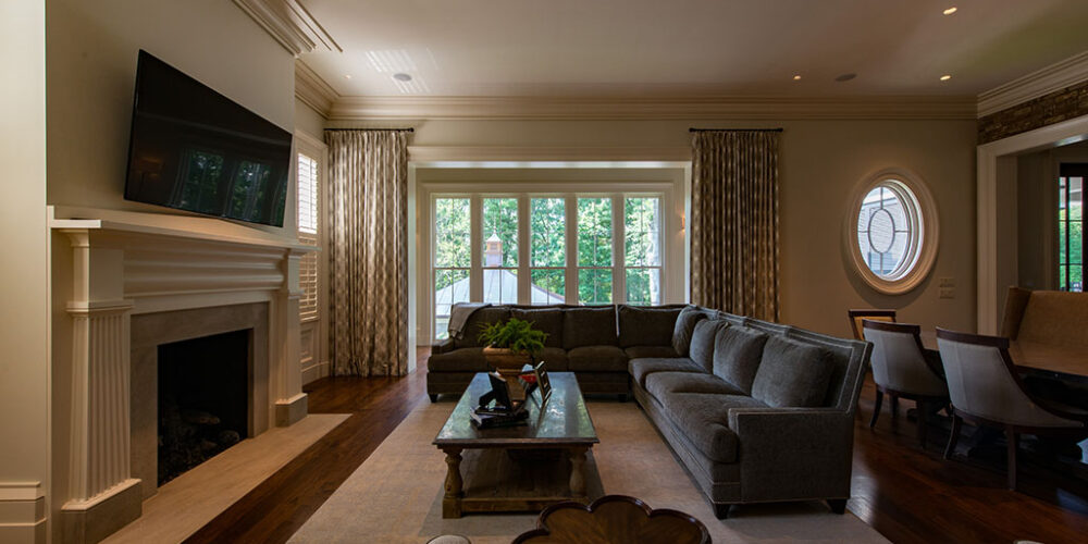 Family living room by Glenn Cope Custom Home Builders