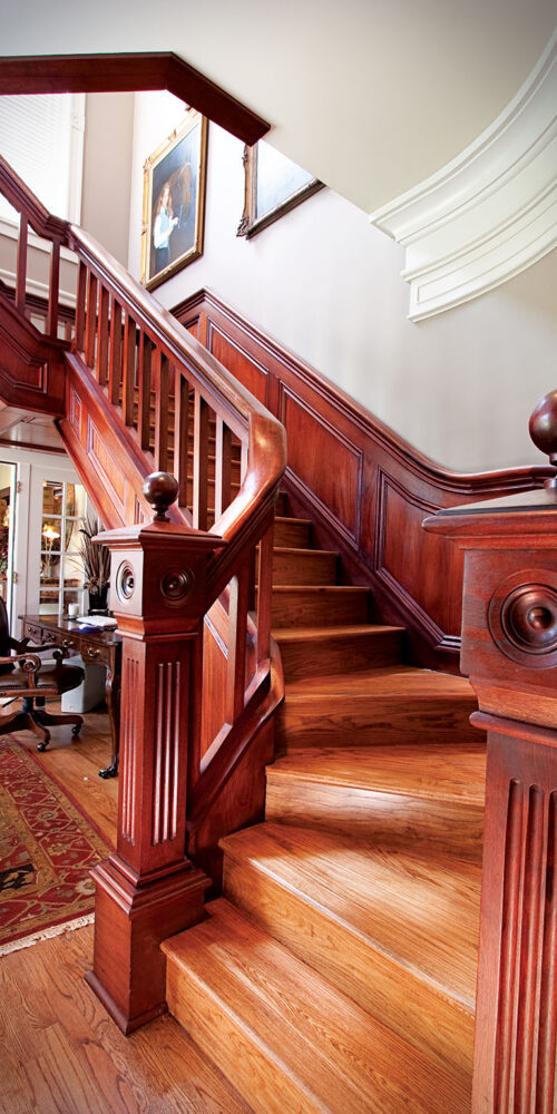 Custom-built grand staircase by Glenn Cope Custom Home Builders