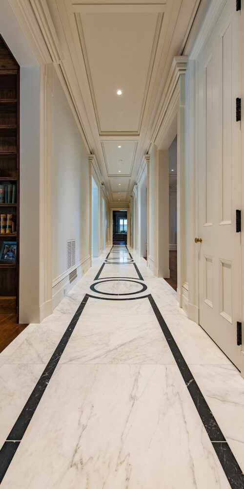 Hallway with custom marble inlay by Glenn Cope Custom Home Builders