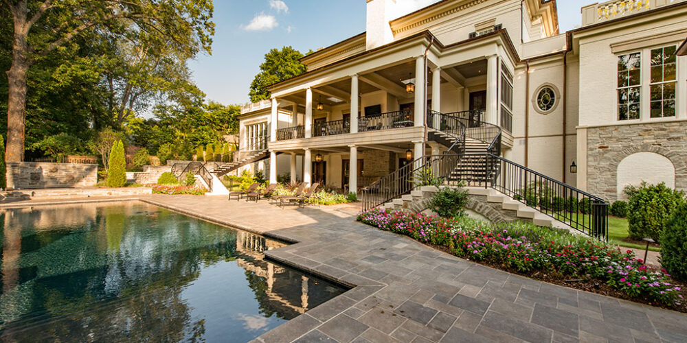 Backyard, terrace, patio, balcony and pool to Greek Revival styled home by Glenn Cope Custom Home Builders