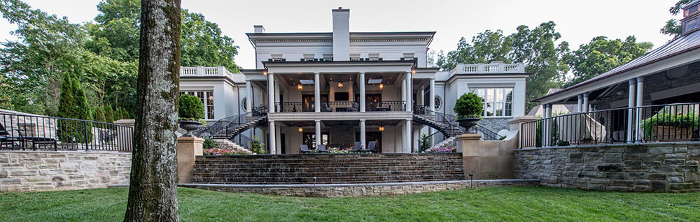 Backyard to Greek Revival styled home by Glenn Cope Custom Home Builders