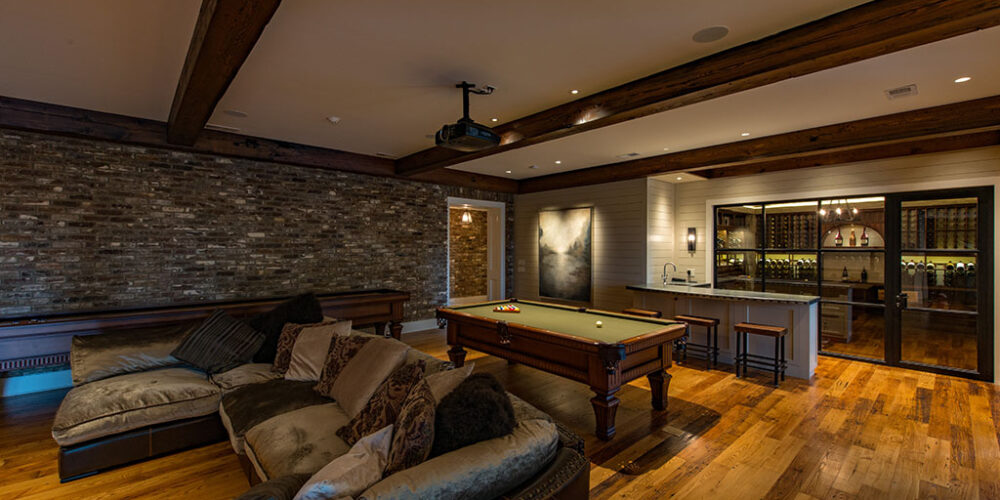 Wetbar, wine cellar, and billiard room by Glenn Cope Custom Home Builders