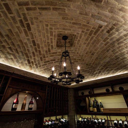 Custom brick ceiling detail in wine cellar by Glenn Cope Custom Home Builders