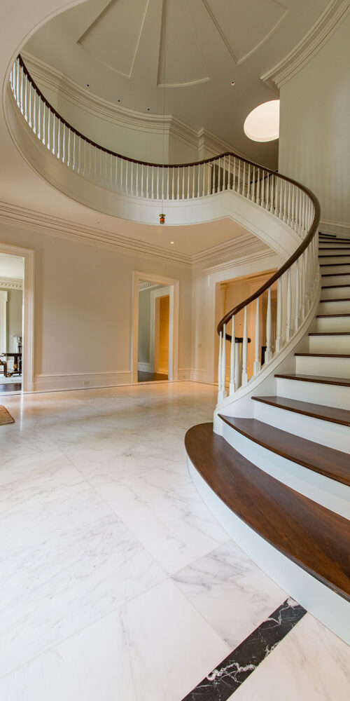 Grand entry way and staircase by Glenn Cope Custom Home Builders