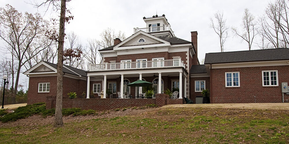 Backyard of Greek Revival style home by Glenn Cope Custom Home Builders