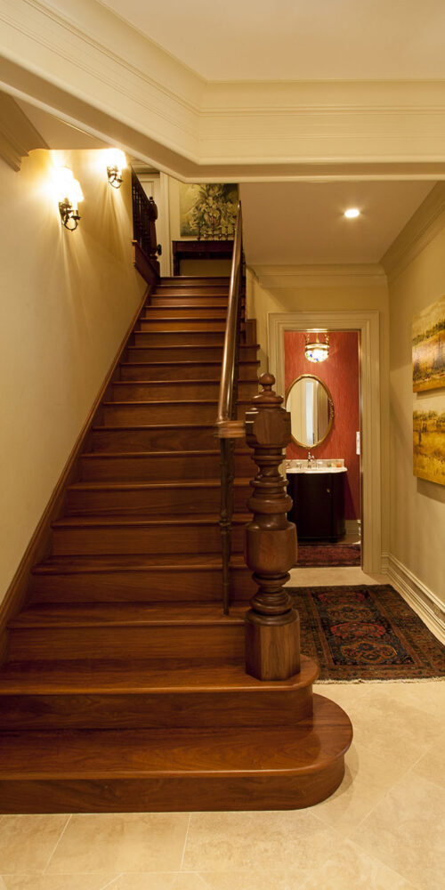 Staircase and guest bathroom by Glenn Cope Custom Home Builders