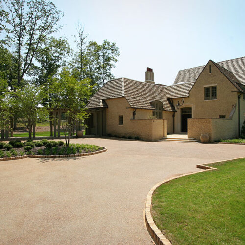 French Cottage style courtyard Custom French cottage-style garage by Glenn Cope Custom Home Builders