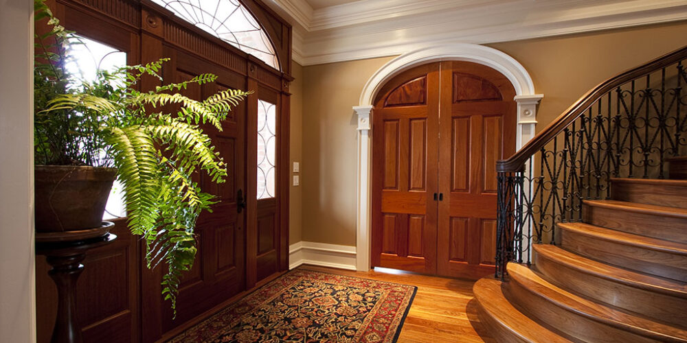 Grand entryway by by Glenn Cope Custom Home Builders