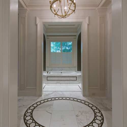 Bathroom rotunda with custom tile inlay by Glenn Cope Custom Home Builders