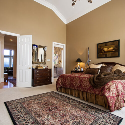 Bedroom in traditional European luxury home by Glenn Cope Custom Home Builders