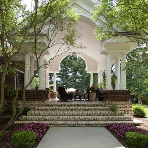 Greek revival style patio lounge by Glenn Cope Custom Home Builders