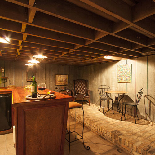 Wine cellar and bar room by Glenn Cope Custom Home Builders