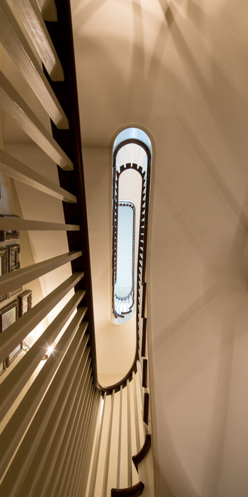Multi-level grand staircase by Glenn Cope Custom Home Builders