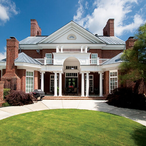 Greek revival style custom courtyard by Glenn Cope Custom Home Builders
