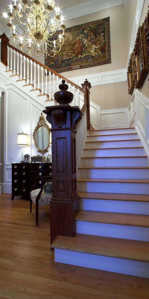 Entryway with stairs in a Colonial styled home by Glenn Cope Custom Home Builders