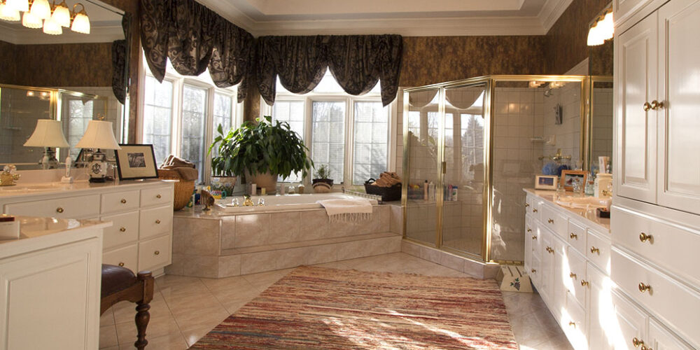Ornate custom bathroom in traditional European luxury home Traditional European mansion by Glenn Cope Custom Home Builders