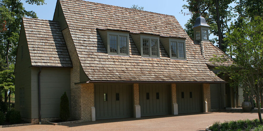 Custom French cottage-style garage by Glenn Cope Custom Home Builders